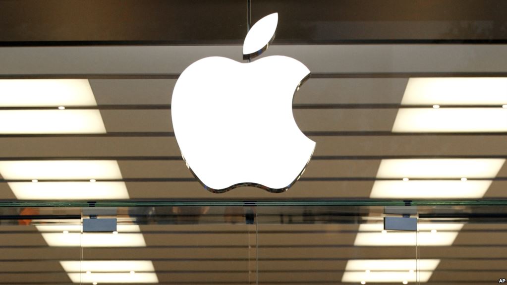 The Apple logo is shown above a store location entrance, Thursday, Sept. 19, 2013, in Dallas. Apple is schedule to release their iPhone 5S on Friday. (AP Photo/Tony Gutierrez)
