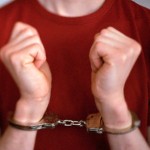 Hands Wearing Handcuffs